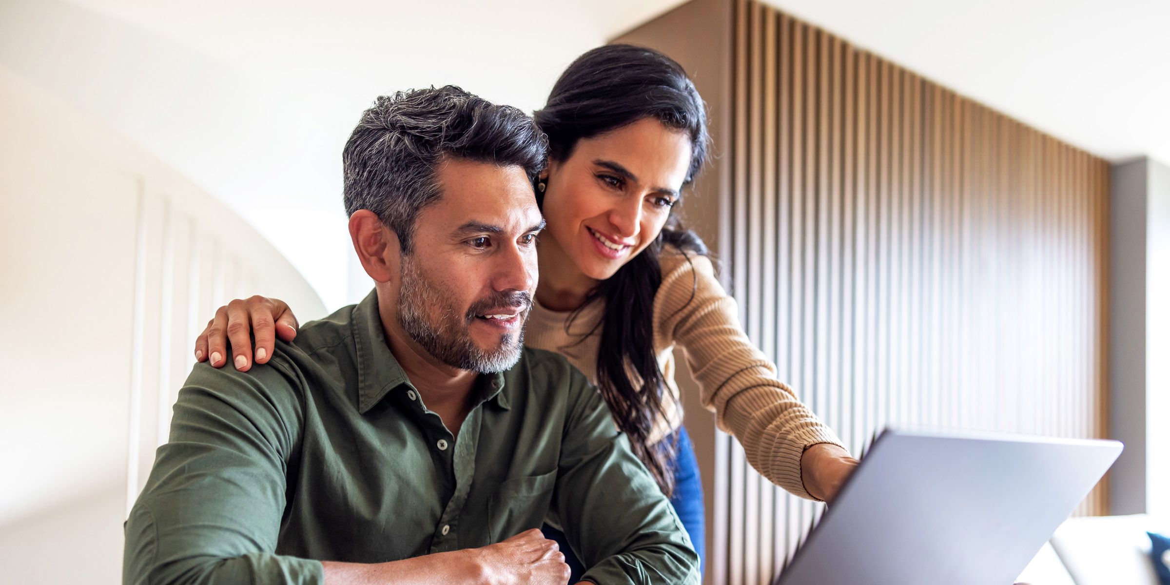 Couple looking at laptop